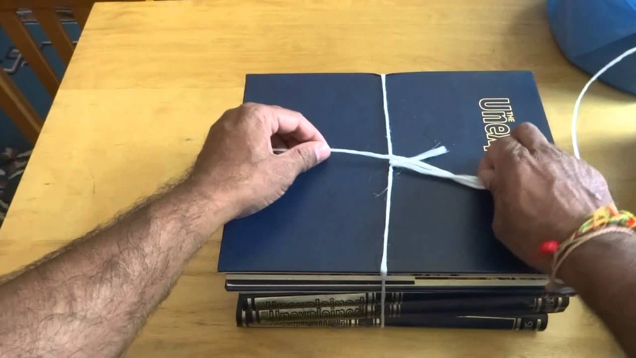 How to tie a very useful Knot to know (i.e. for tying up things like bundles of newspapers etc).