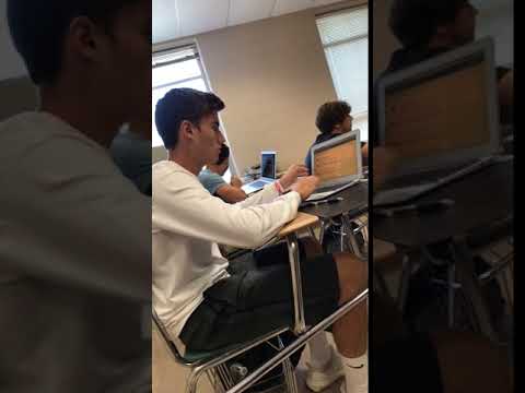 Guy folds his Apple MacBook backwards and breaks it while sitting in the middle of class